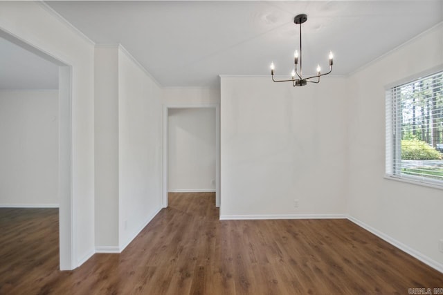 9425 Hogue Rd, Mabelvale, AR 72103 - spare room with ornamental molding, a chandelier, wood finished floors, and baseboards