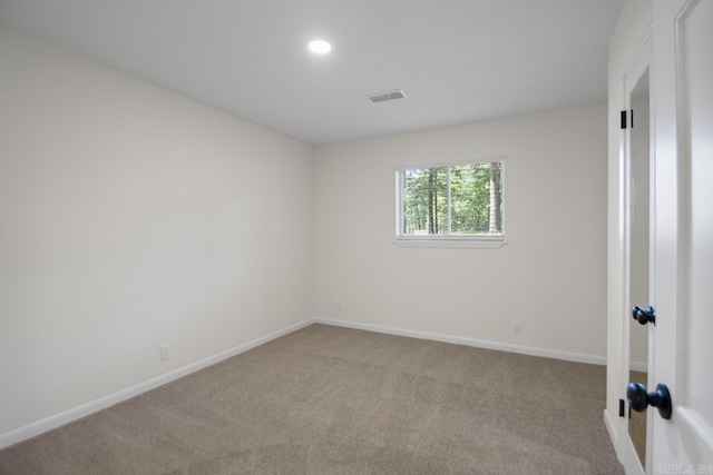 9425 Hogue Rd, Mabelvale, AR 72103 - empty room with light carpet, baseboards, and recessed lighting