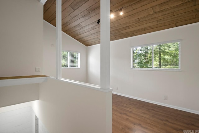 9425 Hogue Rd, Mabelvale, AR 72103 - empty room with wood ceiling, lofted ceiling, wood finished floors, baseboards, and track lighting