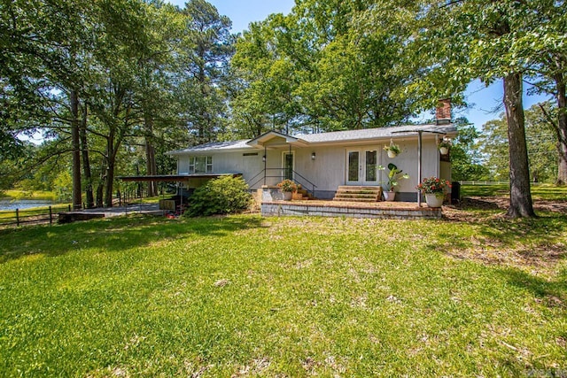 9425 Hogue Rd, Mabelvale, AR 72103 - view of front of property featuring french doors and a chimney
