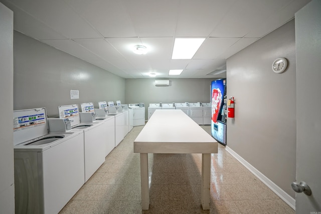 740 Weston Rd Unit 512-C, Hot Springs, AR 71913 - shared laundry room featuring baseboards, washer and clothes dryer, and granite tiled floors