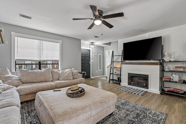 1301 Golf Crse, Jonesboro, AR 72404 - living area with a ceiling fan, wood finished floors, and a fireplace