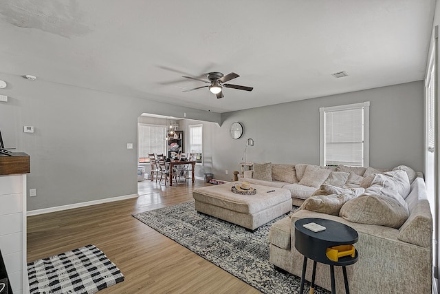 1301 Golf Crse, Jonesboro, AR 72404 - living room featuring ceiling fan, wood finished floors, and baseboards
