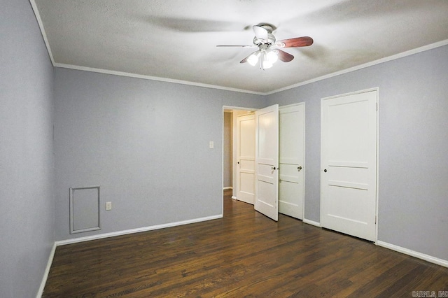 804 N Clarkson Ave, Little Rock, AR 72205 - unfurnished bedroom with crown molding, baseboards, dark wood finished floors, two closets, and ceiling fan