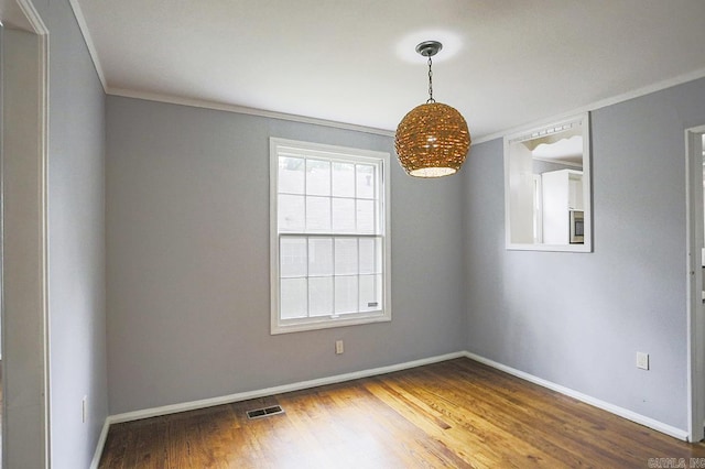 804 N Clarkson Ave, Little Rock, AR 72205 - empty room featuring ornamental molding, wood finished floors, and baseboards