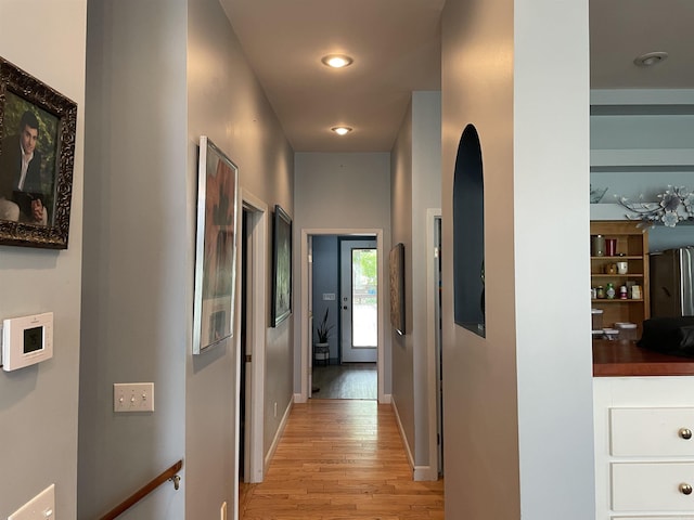 1349 Kahoka Rd, Mountain View, AR 72560 - corridor featuring light wood-style flooring and arched walkways