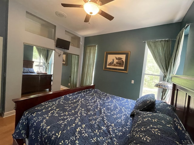 1349 Kahoka Rd, Mountain View, AR 72560 - carpeted bedroom with multiple windows and a ceiling fan