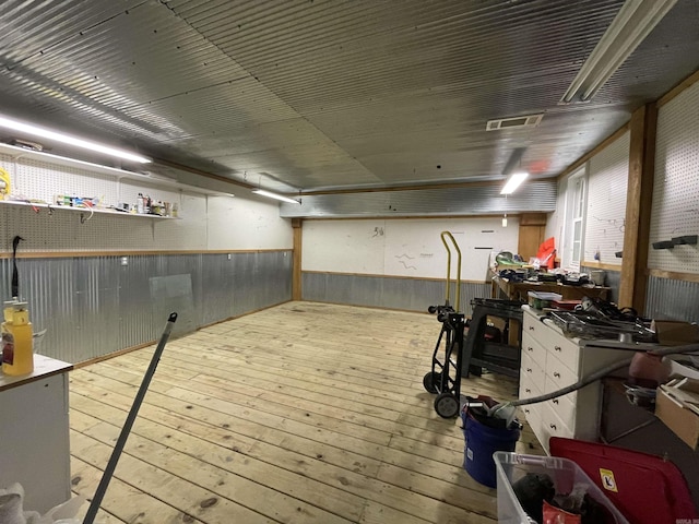 1349 Kahoka Rd, Mountain View, AR 72560 - basement featuring wood-type flooring and wood walls