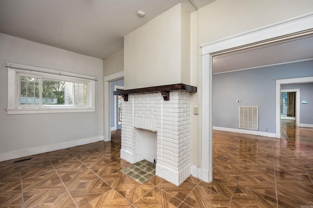 2118 S Battery, Little Rock, AR 72202 - unfurnished living room featuring baseboards and a fireplace