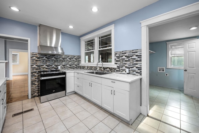 2118 S Battery, Little Rock, AR 72202 - kitchen with a sink, wall chimney range hood, electric range, light countertops, and tasteful backsplash