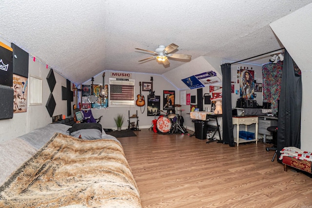 1002 N Bradley Ave, El Dorado, AR 71730 - bedroom featuring wood finished floors, a textured ceiling, vaulted ceiling, and a ceiling fan