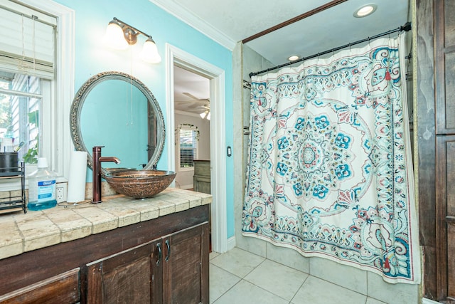 1002 N Bradley Ave, El Dorado, AR 71730 - full bath with crown molding, tile patterned floors, healthy amount of natural light, a ceiling fan, and vanity