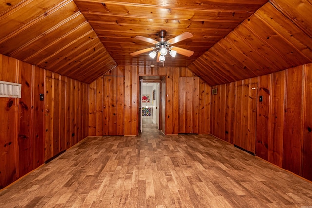 1002 N Bradley Ave, El Dorado, AR 71730 - additional living space with wood finished floors, vaulted ceiling, wood ceiling, wooden walls, and a ceiling fan