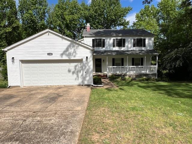 2308 Shoshoni Dr, Jonesboro, AR 72401 - view of front of property featuring covered porch, a garage, concrete driveway, a chimney, and a front lawn