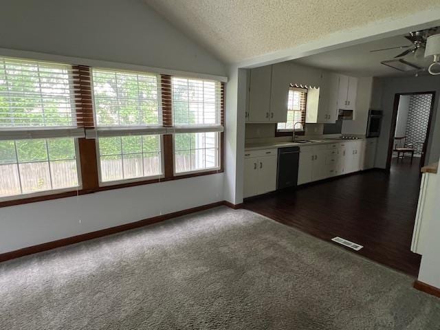 2308 Shoshoni Dr, Jonesboro, AR 72401 - kitchen with dishwasher, dark carpet, wall oven, a textured ceiling, and white cabinets