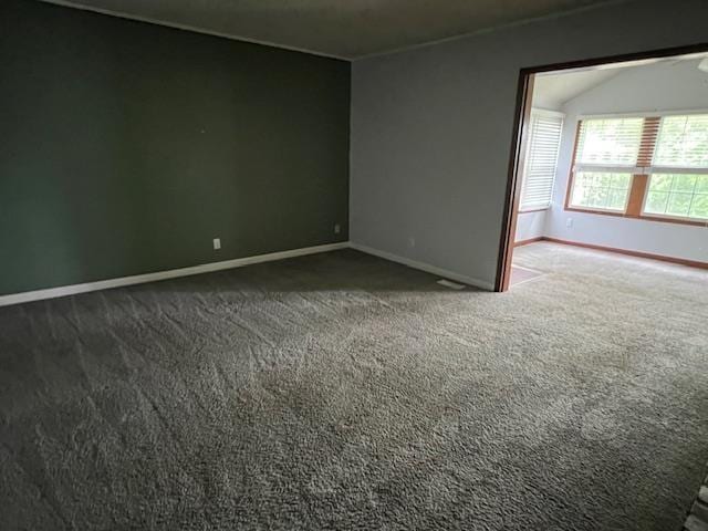 2308 Shoshoni Dr, Jonesboro, AR 72401 - unfurnished room featuring baseboards, carpet, and lofted ceiling
