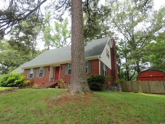807 N Park Dr, Arkadelphia, AR 71923 - view of front of home with brick siding, a chimney, an outdoor structure, and crawl space