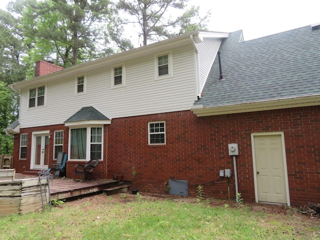 807 N Park Dr, Arkadelphia, AR 71923 - rear view of house featuring a wooden deck, a chimney, brick siding, french doors, and roof with shingles