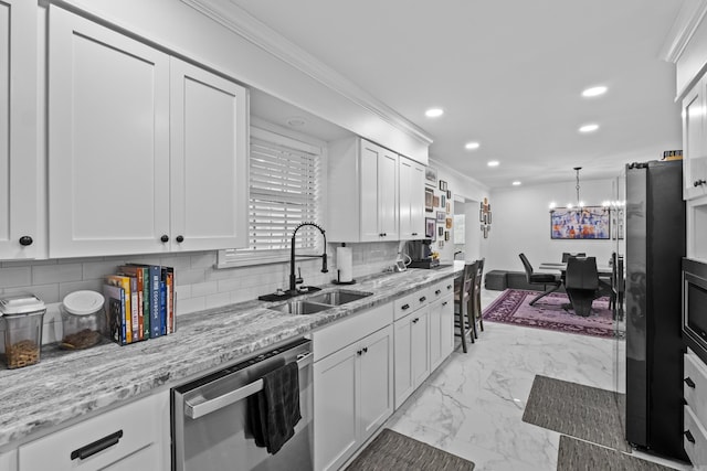 4812 Randolph Rd, North Little Rock, AR 72116 - kitchen featuring appliances with stainless steel finishes, a sink, recessed lighting, light marble finish flooring, and a chandelier