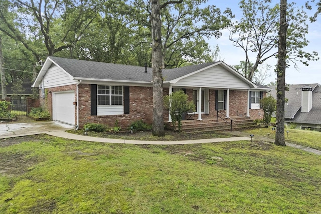 4812 Randolph Rd, North Little Rock, AR 72116 - single story home with brick siding, an attached garage, covered porch, a front lawn, and driveway