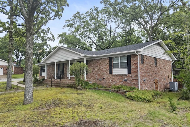 4812 Randolph Rd, North Little Rock, AR 72116 - ranch-style home featuring central air condition unit, a front yard, brick siding, and covered porch