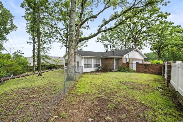 4812 Randolph Rd, North Little Rock, AR 72116 - back of house featuring a gate and brick siding