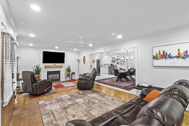 4812 Randolph Rd, North Little Rock, AR 72116 - living room featuring crown molding, a glass covered fireplace, ceiling fan, wood finished floors, and recessed lighting