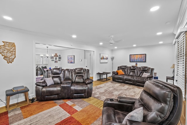 4812 Randolph Rd, North Little Rock, AR 72116 - living room featuring a ceiling fan, recessed lighting, light wood-style flooring, a chandelier, and crown molding