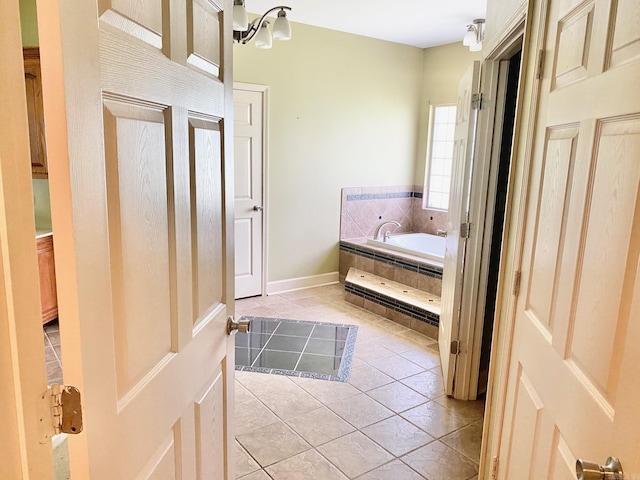 334 Grant 190009, White Hall, AR 71602 - bathroom featuring a garden tub, tile patterned flooring, and baseboards