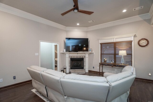766 Mango Loop, Austin, AR 72007 - living area with ornamental molding, ceiling fan, a tile fireplace, baseboards, and dark wood finished floors