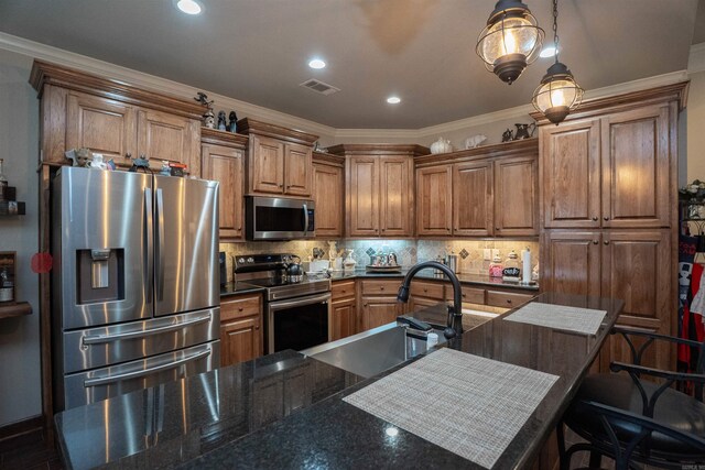 766 Mango Loop, Austin, AR 72007 - kitchen with stainless steel appliances, a sink, brown cabinets, backsplash, and crown molding