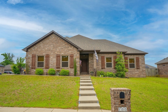 766 Mango Loop, Austin, AR 72007 - view of front of home featuring brick siding and roof with shingles