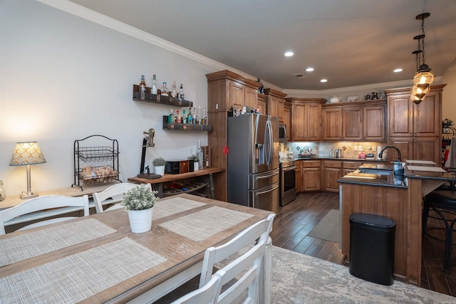 766 Mango Loop, Austin, AR 72007 - kitchen with appliances with stainless steel finishes, crown molding, a peninsula, brown cabinets, and dark wood-type flooring