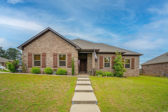 766 Mango Loop, Austin, AR 72007 - view of front of home with brick siding and a front lawn