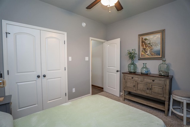 766 Mango Loop, Austin, AR 72007 - bedroom with carpet, a closet, a ceiling fan, and baseboards