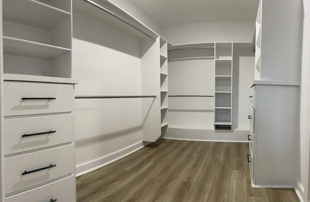 2033 Kaysen Ln, Hensley, AR 72065 - spacious closet featuring dark wood-style flooring