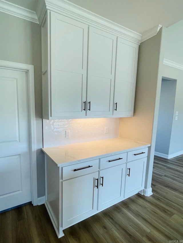 2033 Kaysen Ln, Hensley, AR 72065 - detailed view of crown molding, wood finished floors, decorative backsplash, and baseboards