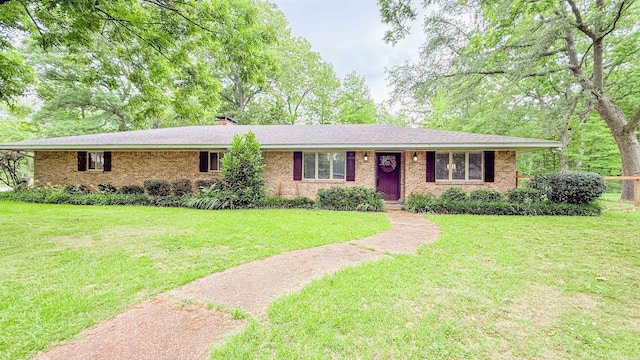 38 Wolfe, Mcgehee, AR 71654 - single story home with a front lawn, brick siding, and a chimney