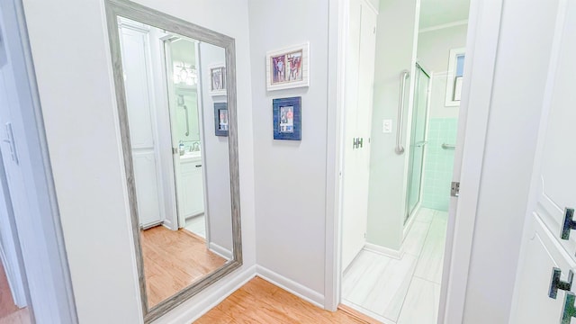 38 Wolfe, Mcgehee, AR 71654 - hall with baseboards, light wood-style flooring, and a sink