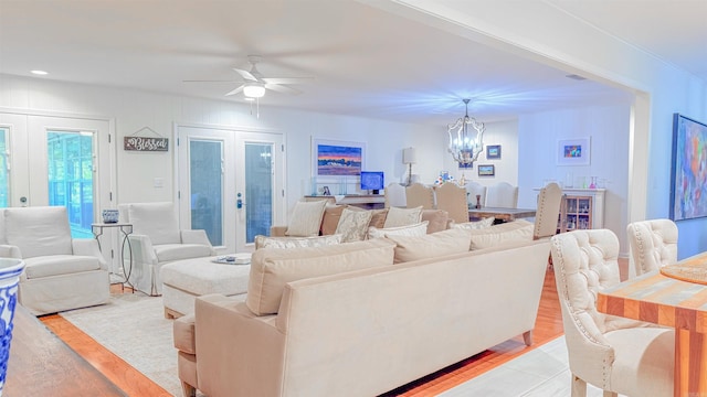 38 Wolfe, Mcgehee, AR 71654 - living room featuring a chandelier, french doors, a ceiling fan, and light wood-style flooring