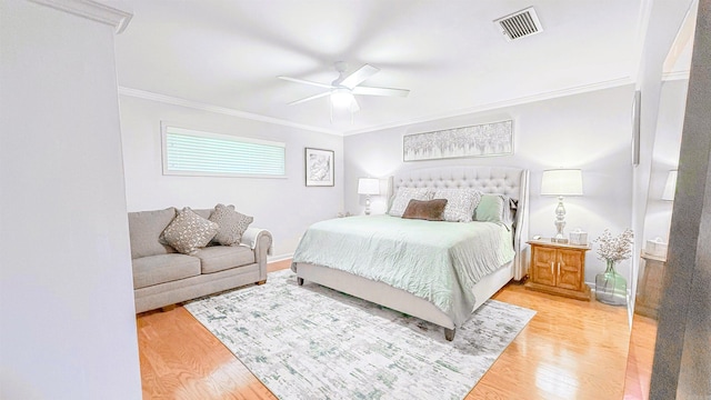 38 Wolfe, Mcgehee, AR 71654 - bedroom with ornamental molding, light wood-style flooring, and ceiling fan