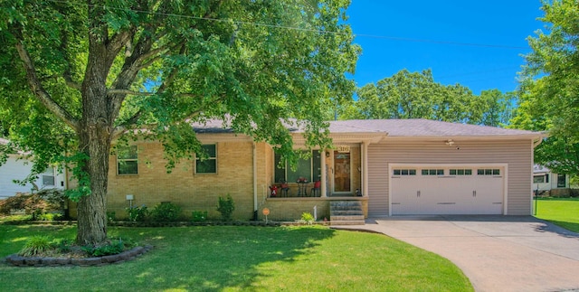 316 W 33rd Pl, North Little Rock, AR 72118 - view of front of property featuring a garage, driveway, a front lawn, and a porch