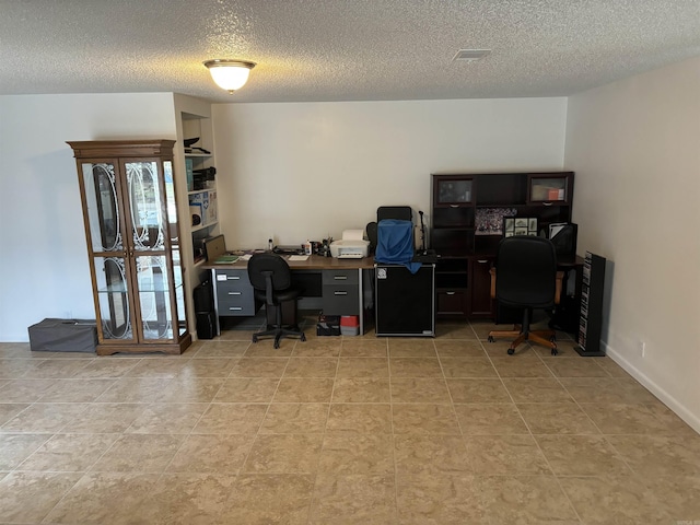 office space with a textured ceiling