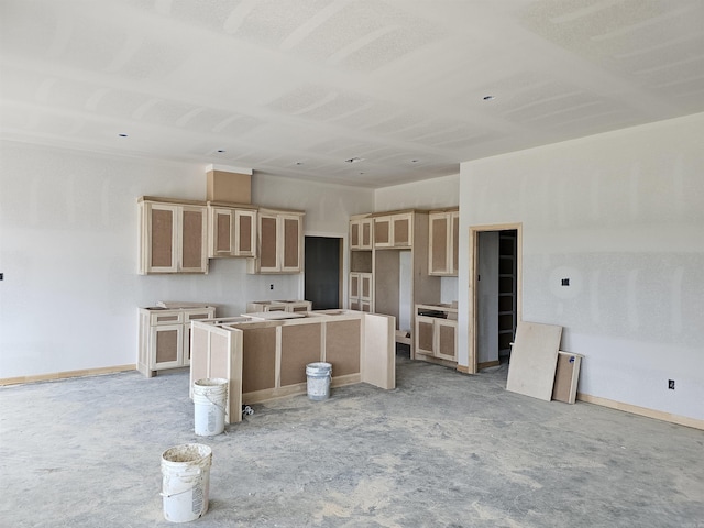 180 Kelton St, Hensley, AR 72065 - kitchen featuring a kitchen island, baseboards, and light brown cabinets