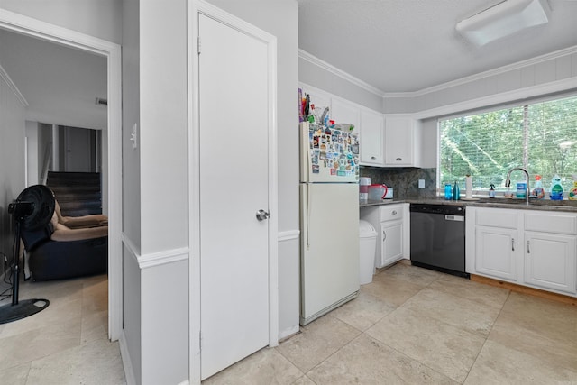 11801 Pleasant Frst, Little Rock, AR 72212 - kitchen featuring stainless steel dishwasher, freestanding refrigerator, a sink, ornamental molding, and white cabinetry