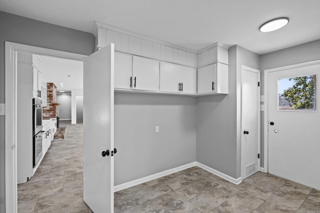 7011 W Markham St, Little Rock, AR 72205 - laundry room featuring baseboards