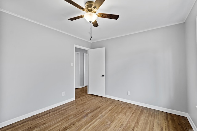 7011 W Markham St, Little Rock, AR 72205 - empty room featuring baseboards, wood finished floors, ceiling fan, and crown molding