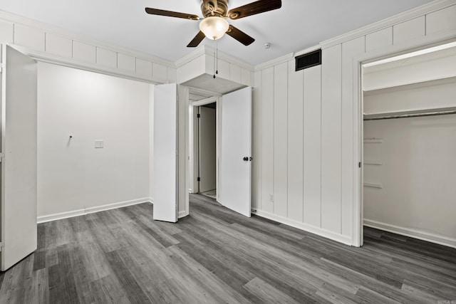 7011 W Markham St, Little Rock, AR 72205 - unfurnished bedroom featuring wood finished floors, baseboards, and ceiling fan