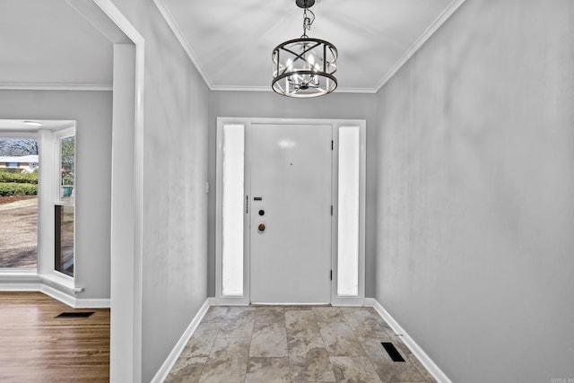 7011 W Markham St, Little Rock, AR 72205 - foyer with baseboards, a chandelier, crown molding, and stone finish flooring
