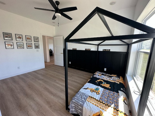 1656 Airport Dr, Mountain View, AR 72560 - bedroom with multiple windows, wood finished floors, baseboards, and ceiling fan